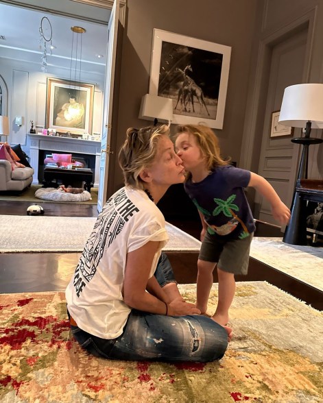 HEART OF STONE: Sharon Stone puckers up for a kiss from her godson Cosmo.