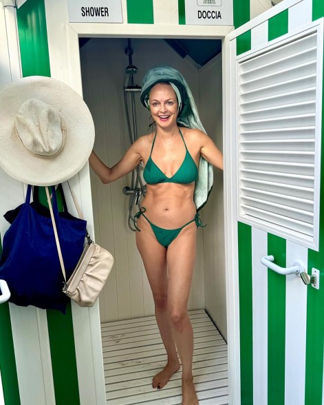 SHOWER POWER: Heather Graham rinses off after a dip in Italy.