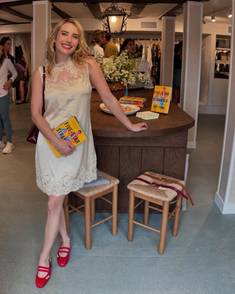 emma roberts posing at a book store