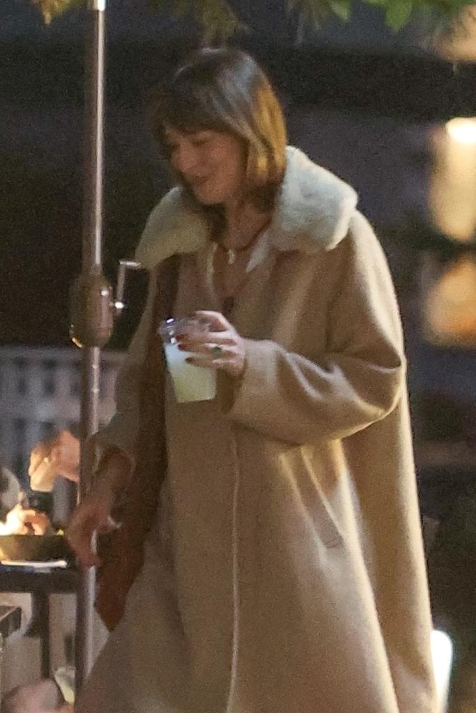 Dakota Johnson was seen with a drink as her ring was noticeably on her finger on Friday.