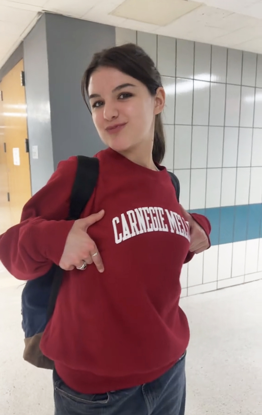 Suri Cruise showing off a college sweatshirt